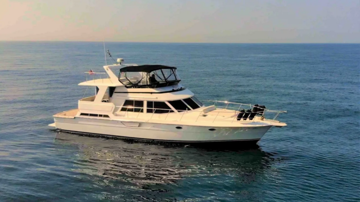 White 57ft luxury yacht cruising along the Southern California coast