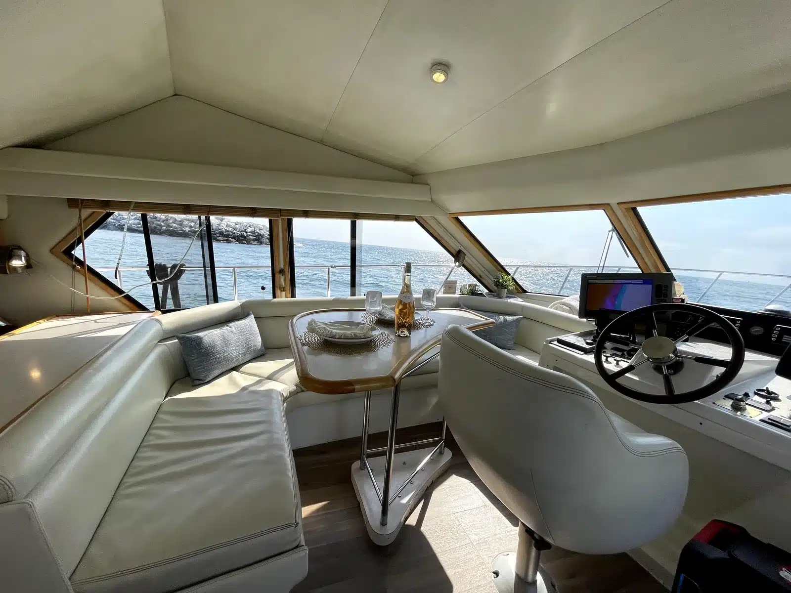 Indoor dining area aboard the Lady M private charter yacht