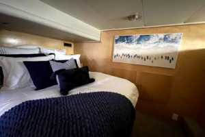 Primary bedroom with sleeping accommodations aboard Lady M